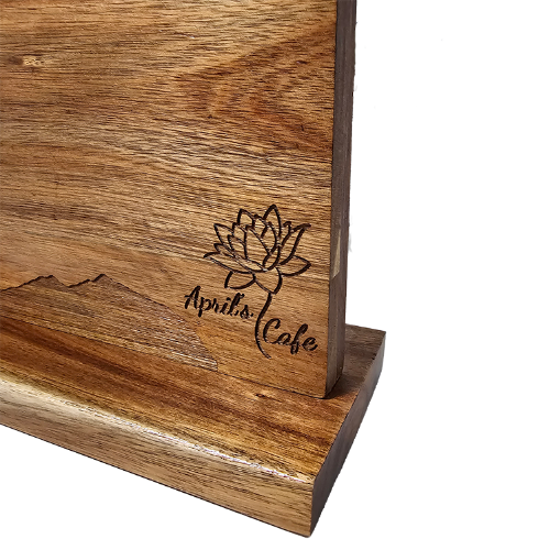 closeup of engraved wooden magnetic knife block