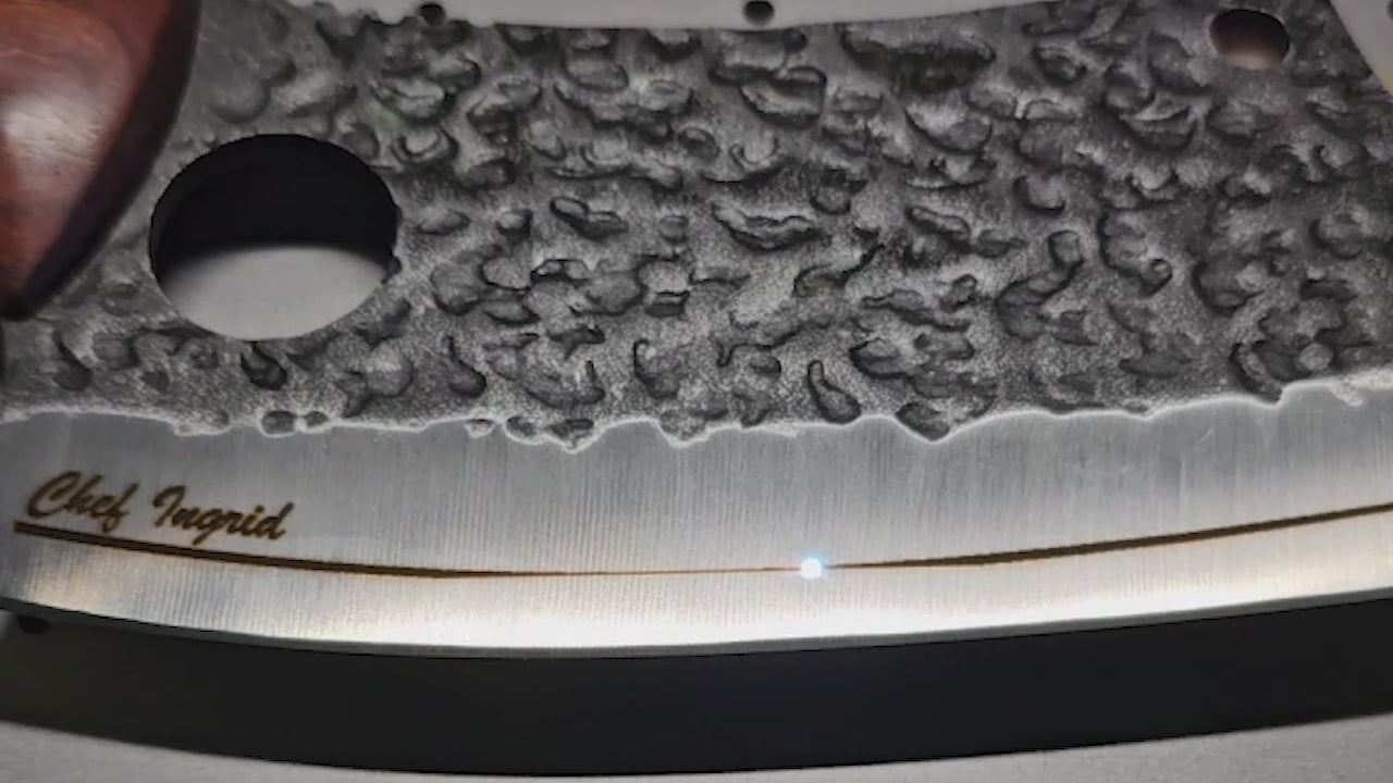 closeup video of knife blade being laser engraved