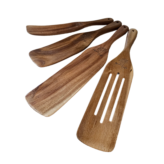 Set of engraved wooden spatulas on a white background