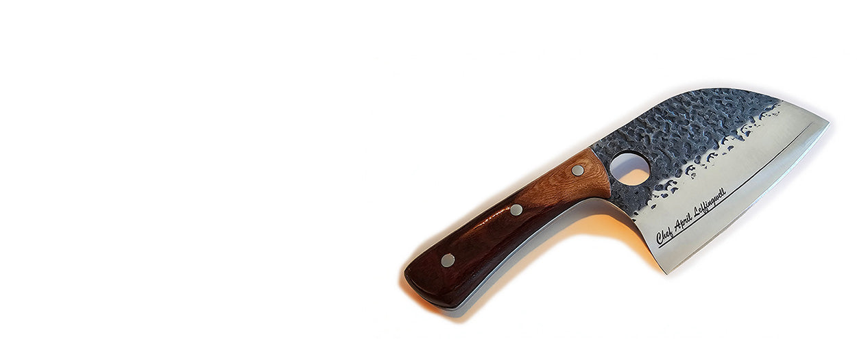 Engraved Chef knife with wooden handle and textured blade on a white background