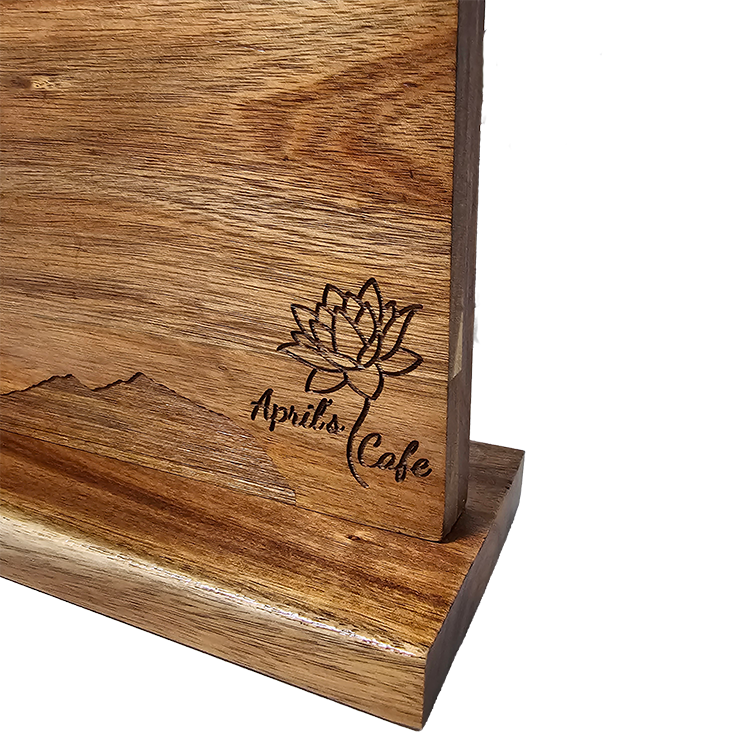 closeup of engraved wooden magnetic knife block