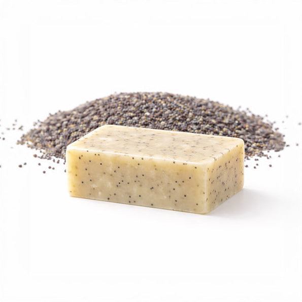 Bar of Desert Poppy Seed soap with a pile of poppy seed on a white background 